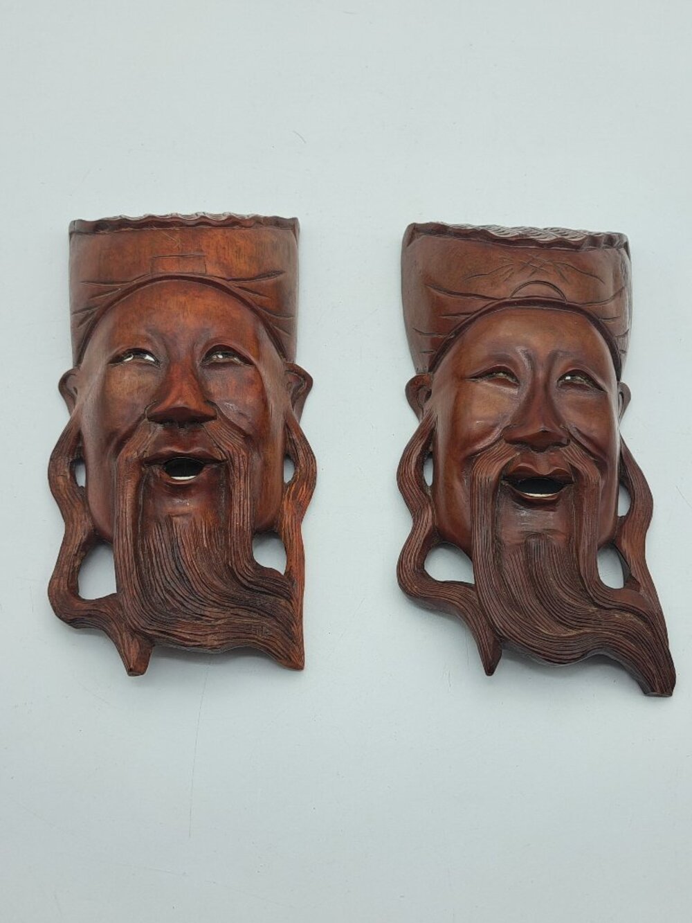 Pair of Carved Wooden Chinese Wall Masks